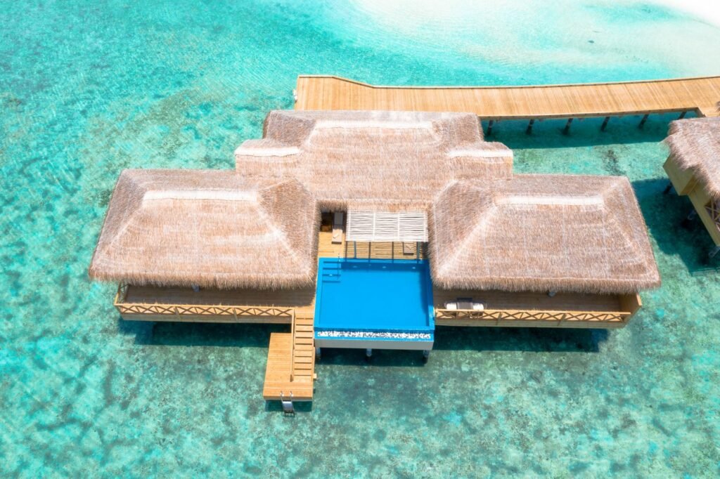 Luxury private villa with a pool over the water, the kind of high-end stay now eligible for the Amex Platinum Lodging Credit